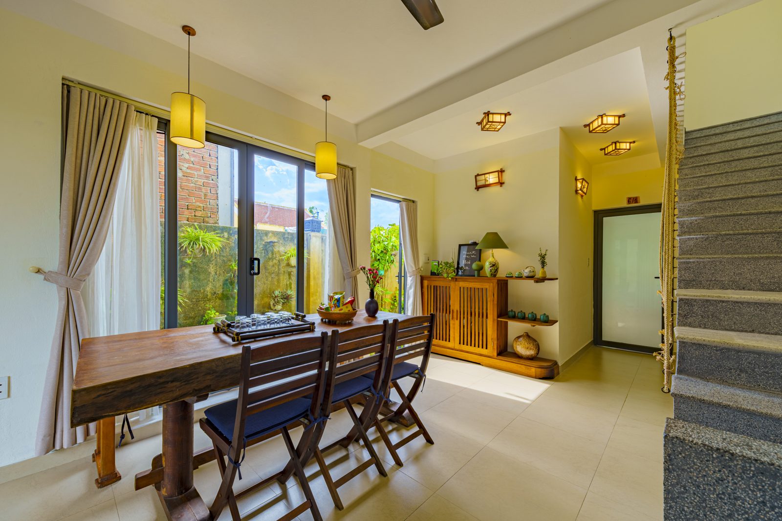 Dining room with a solid-wood table and garden doors