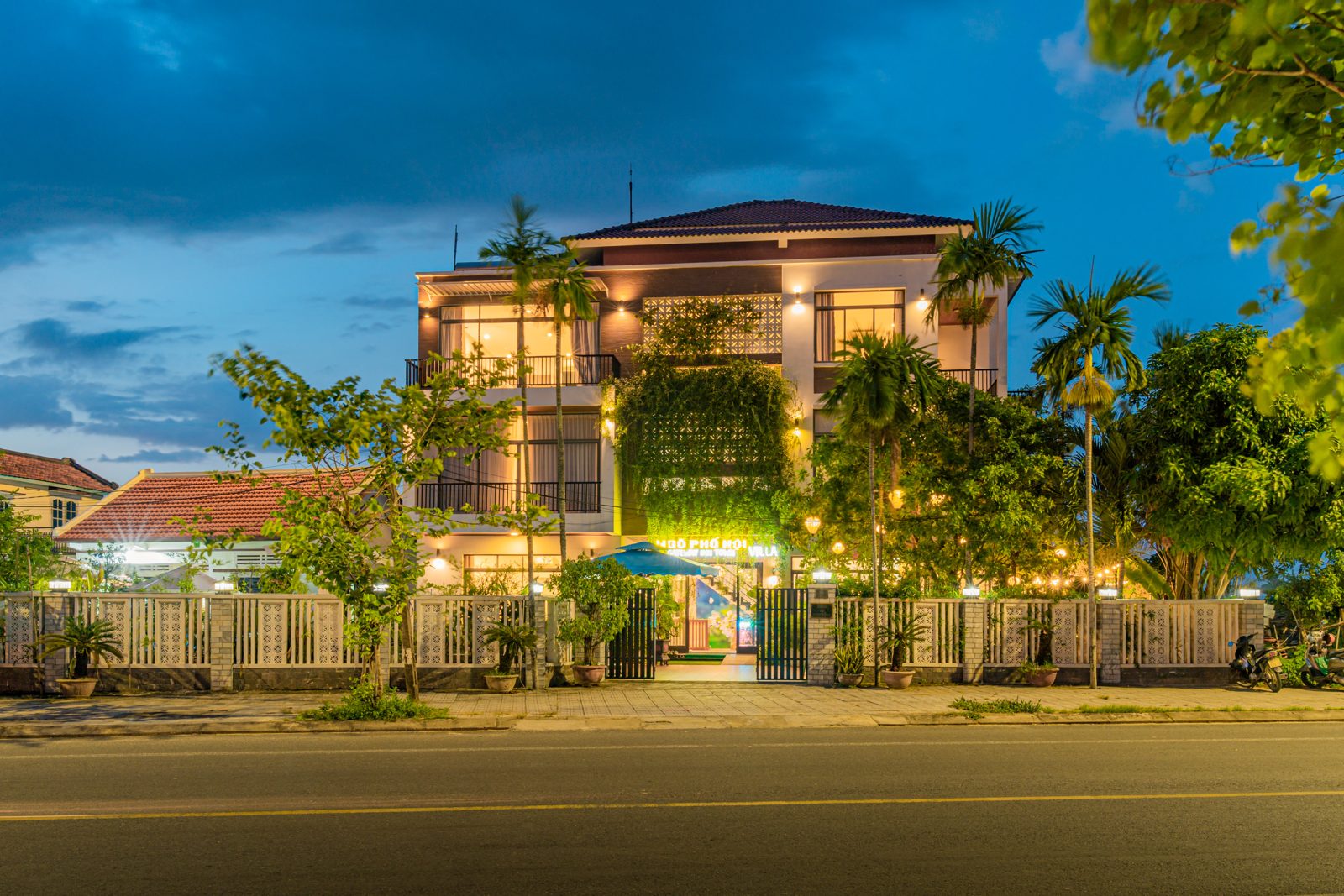 Gateway Inn façade lit up at blue hour