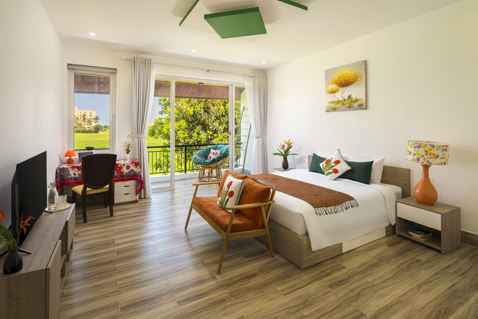 Bedroom with leather armchair and balcony doors