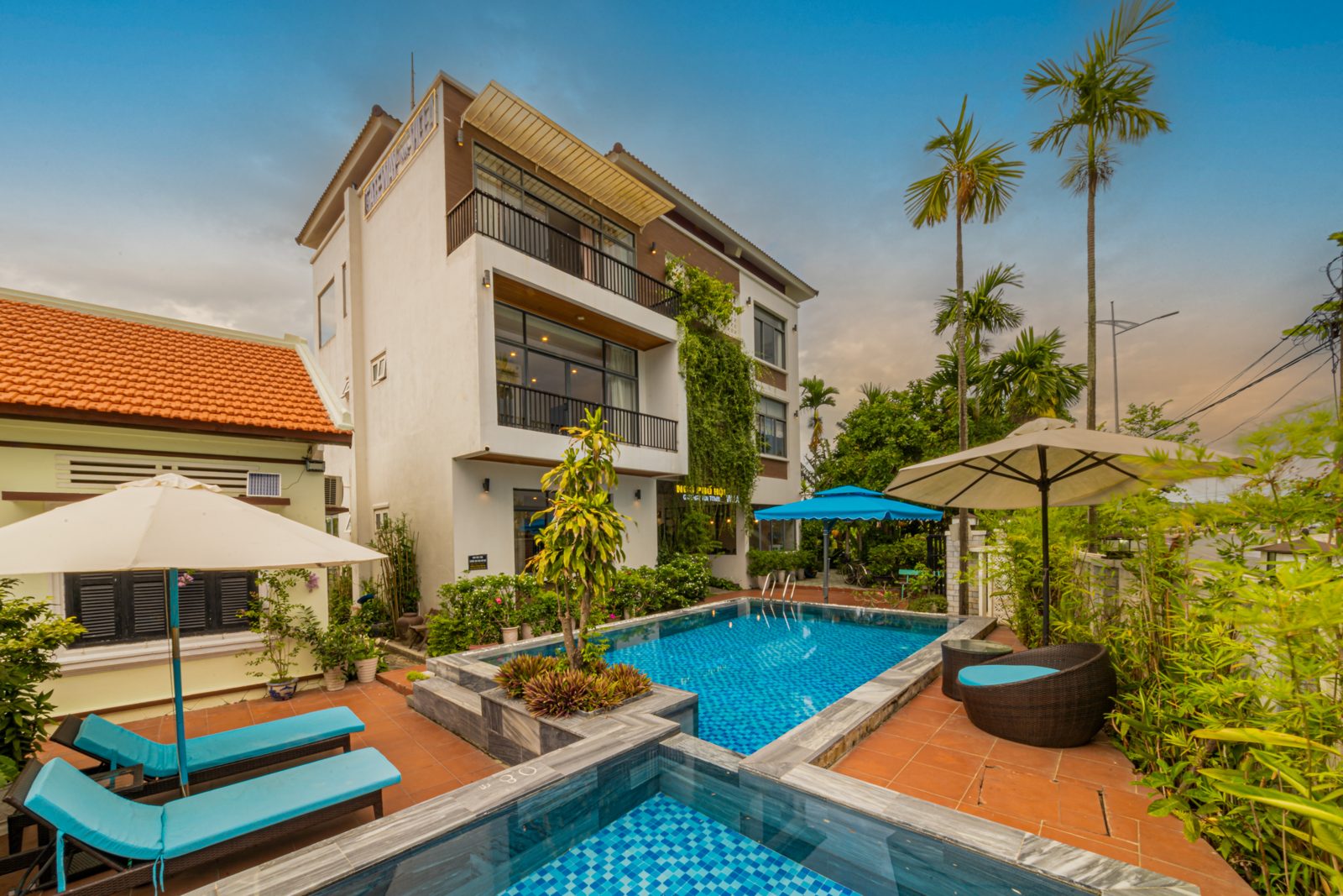 Main pool and kids' pool side by side with loungers