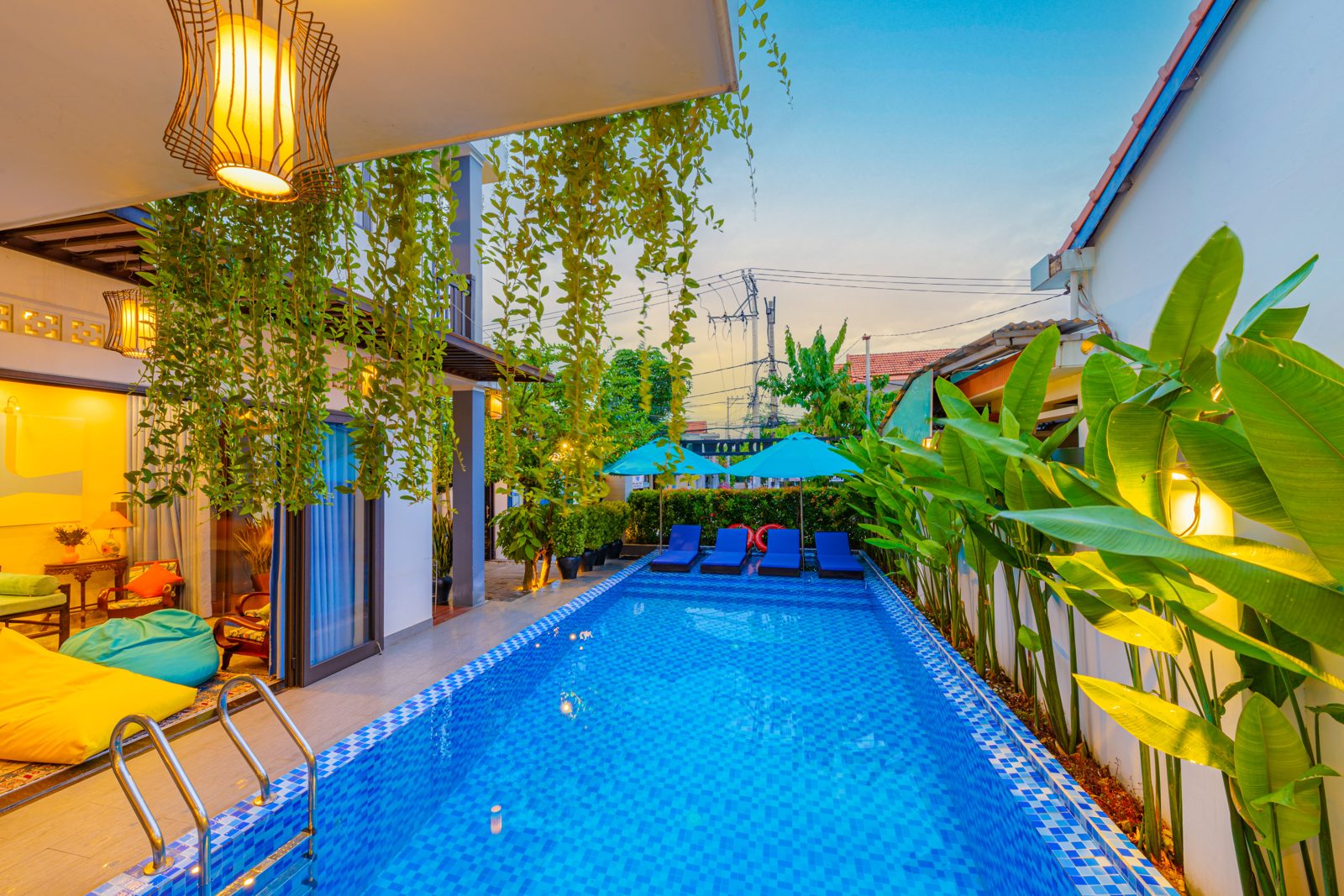 Mountain View Villa's long blue pool at sunset