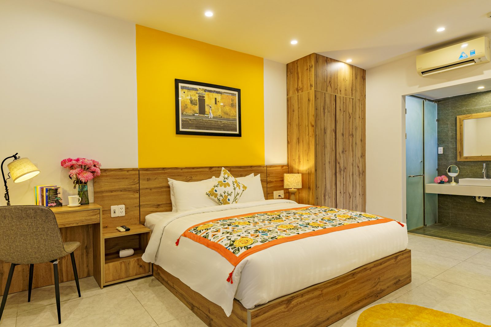 Bedroom with desk lamp and en-suite bathroom