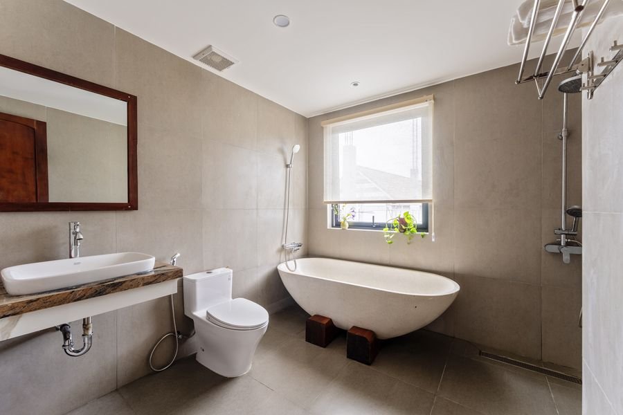 Bathroom with freestanding bathtub and garden window