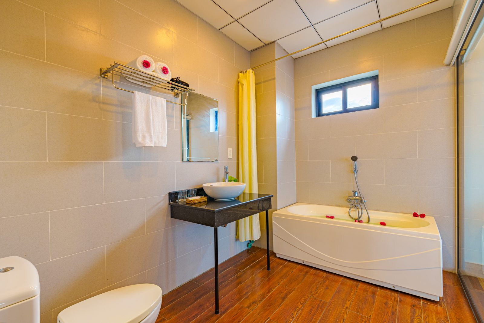 Bathroom with bathtub and wood-look floor
