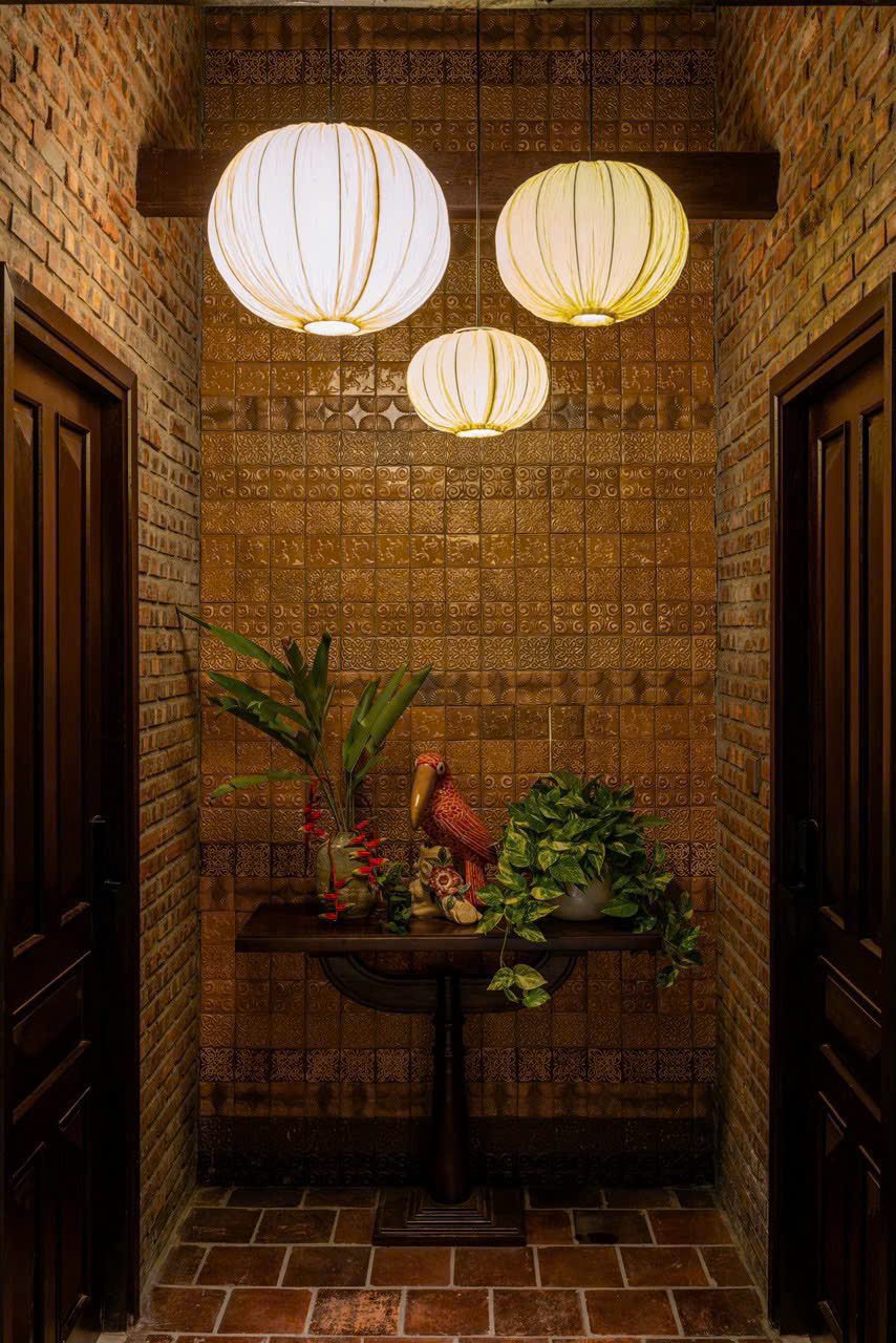 Brick passage hung with white silk lanterns