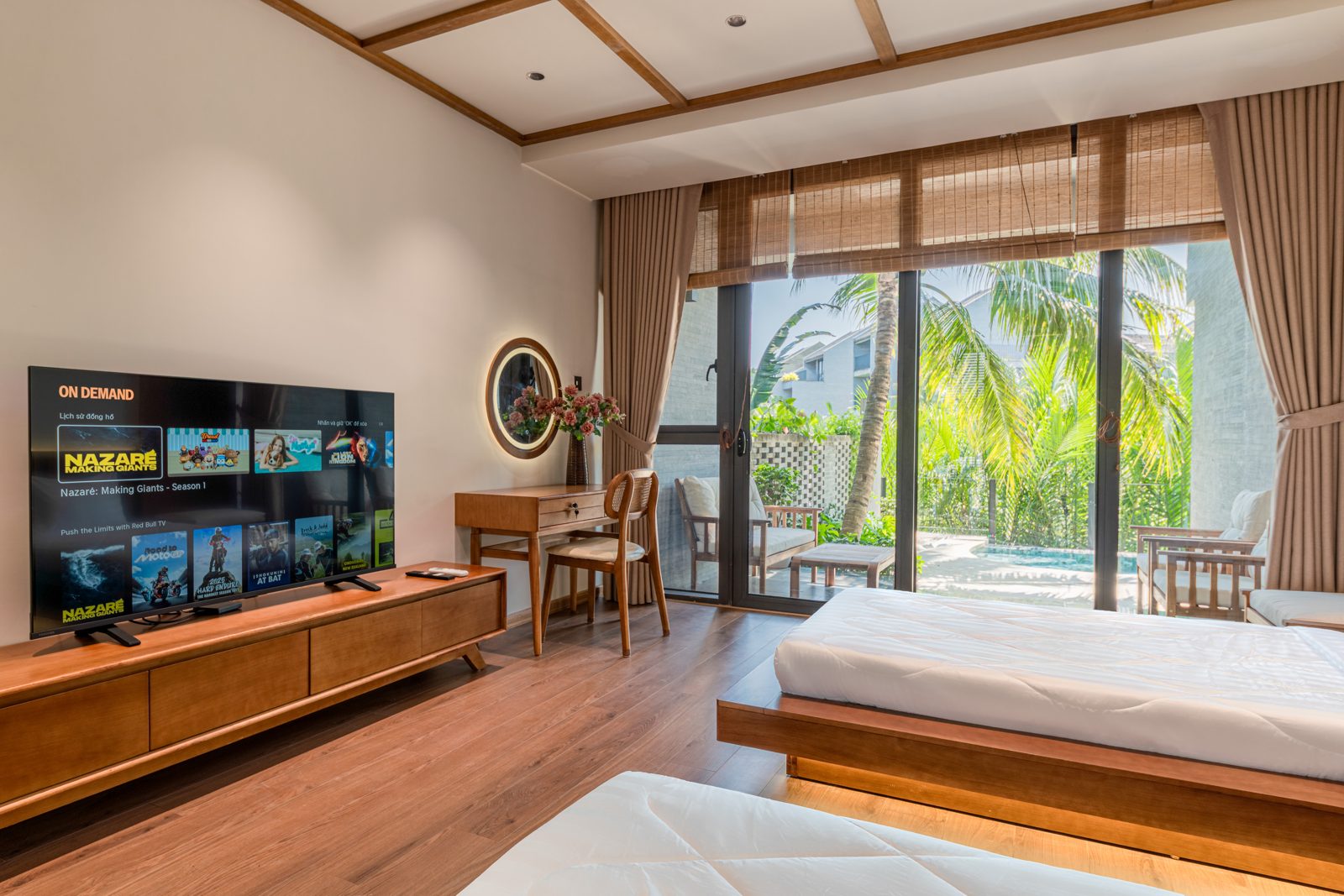 Bedroom with platform bed, TV console and garden doors
